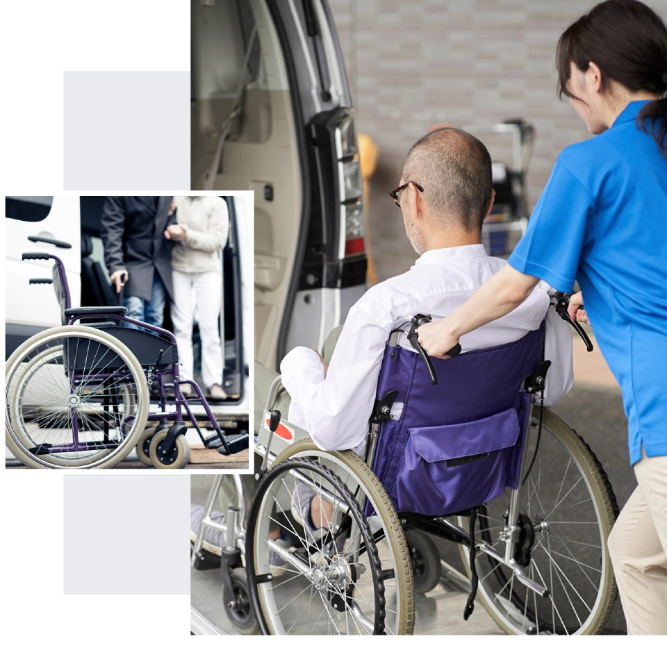 Caregiver assisting person in wheelchair to van.